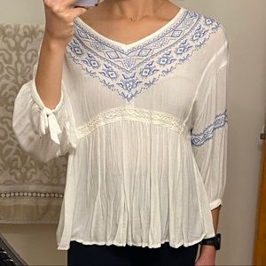 Blue and white blouse.